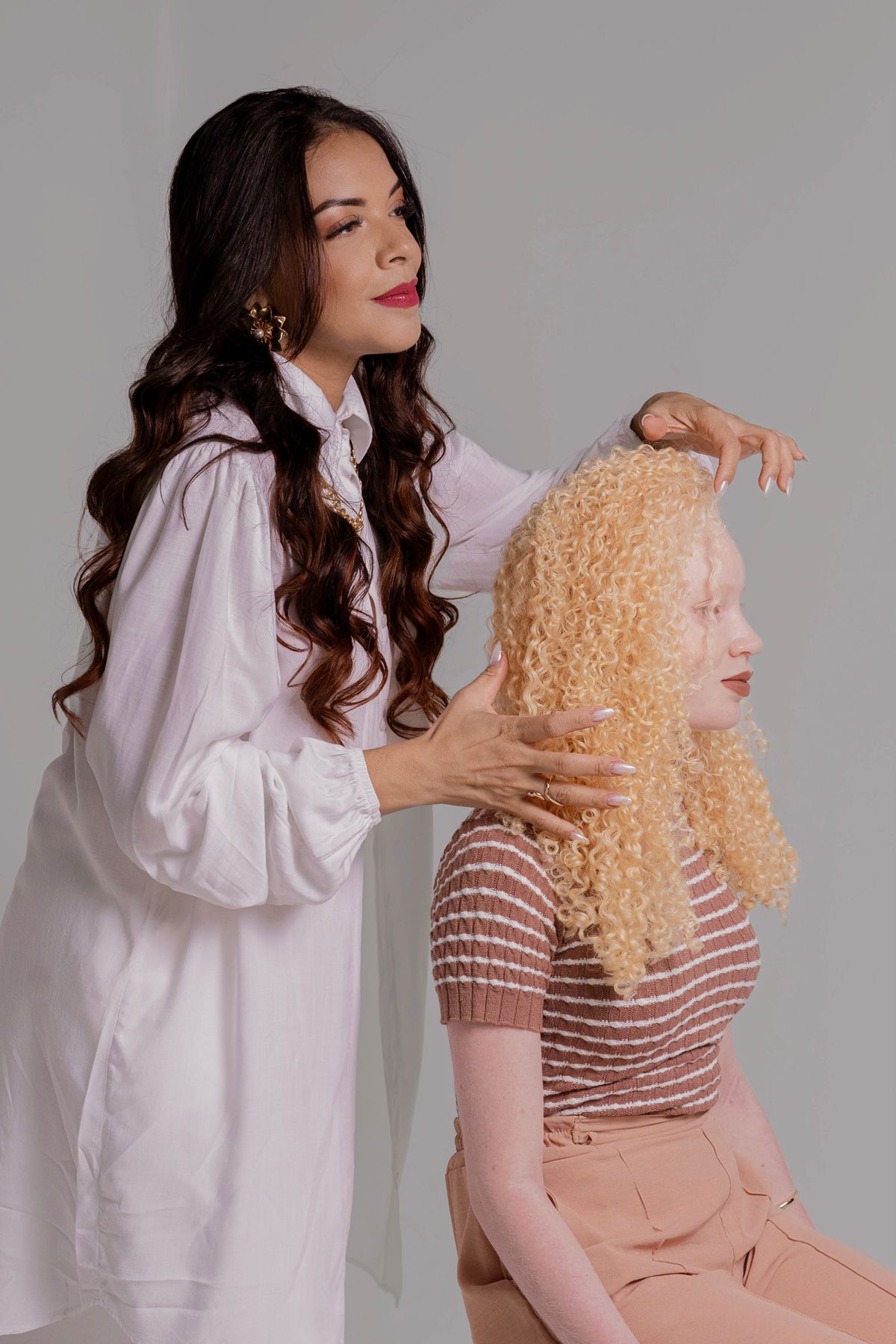 Stylist working with clients in a salon