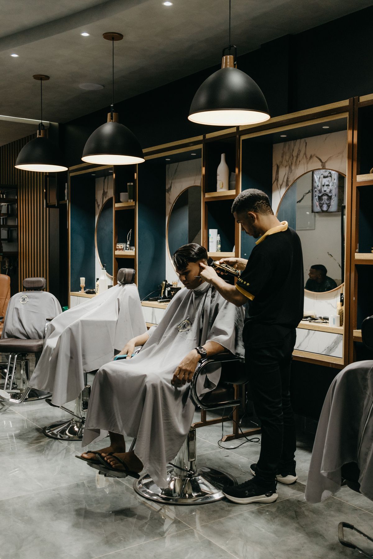 Barber cutting a client's hair