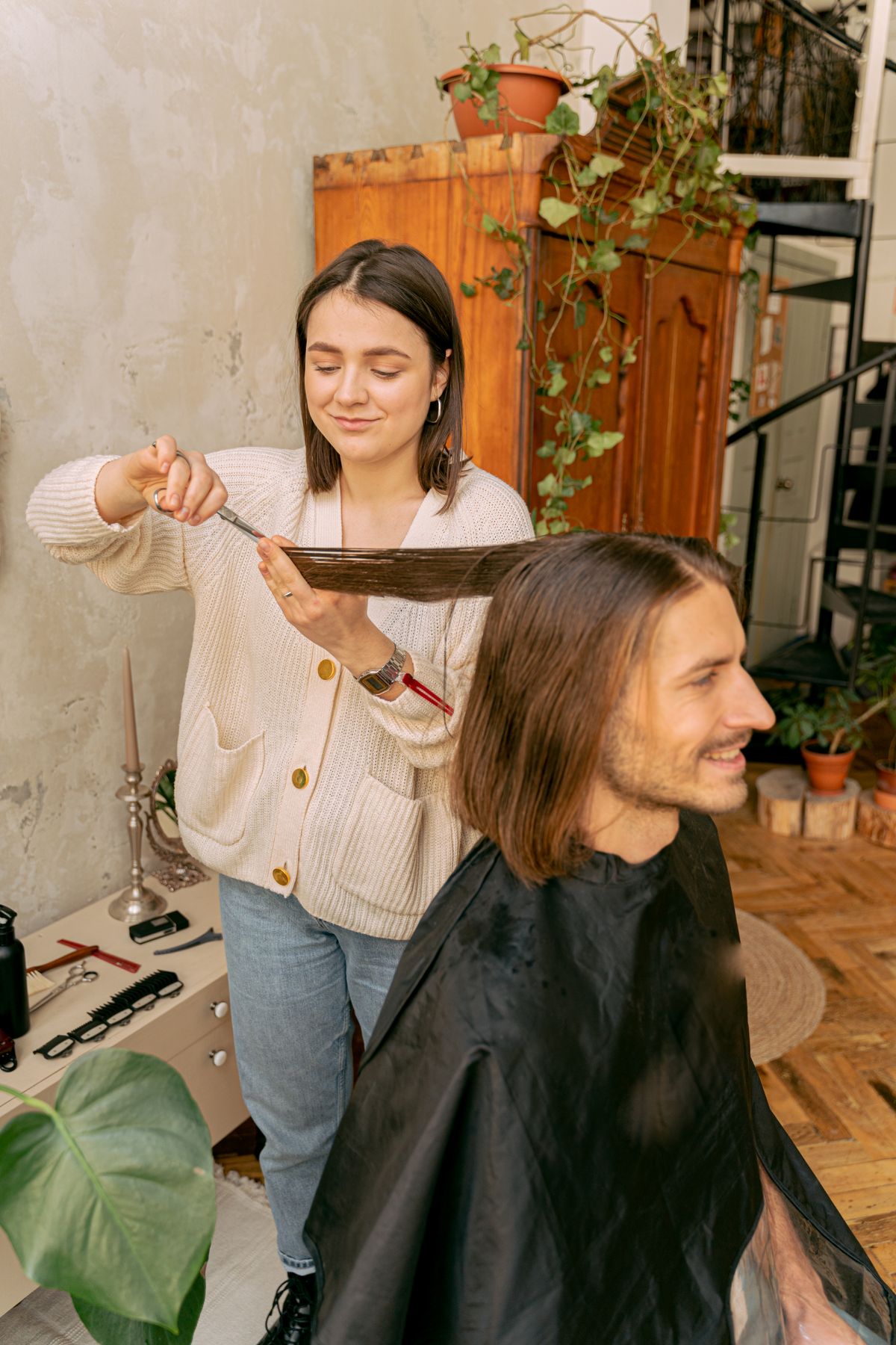 Stylist cutting a client's hair in the salon